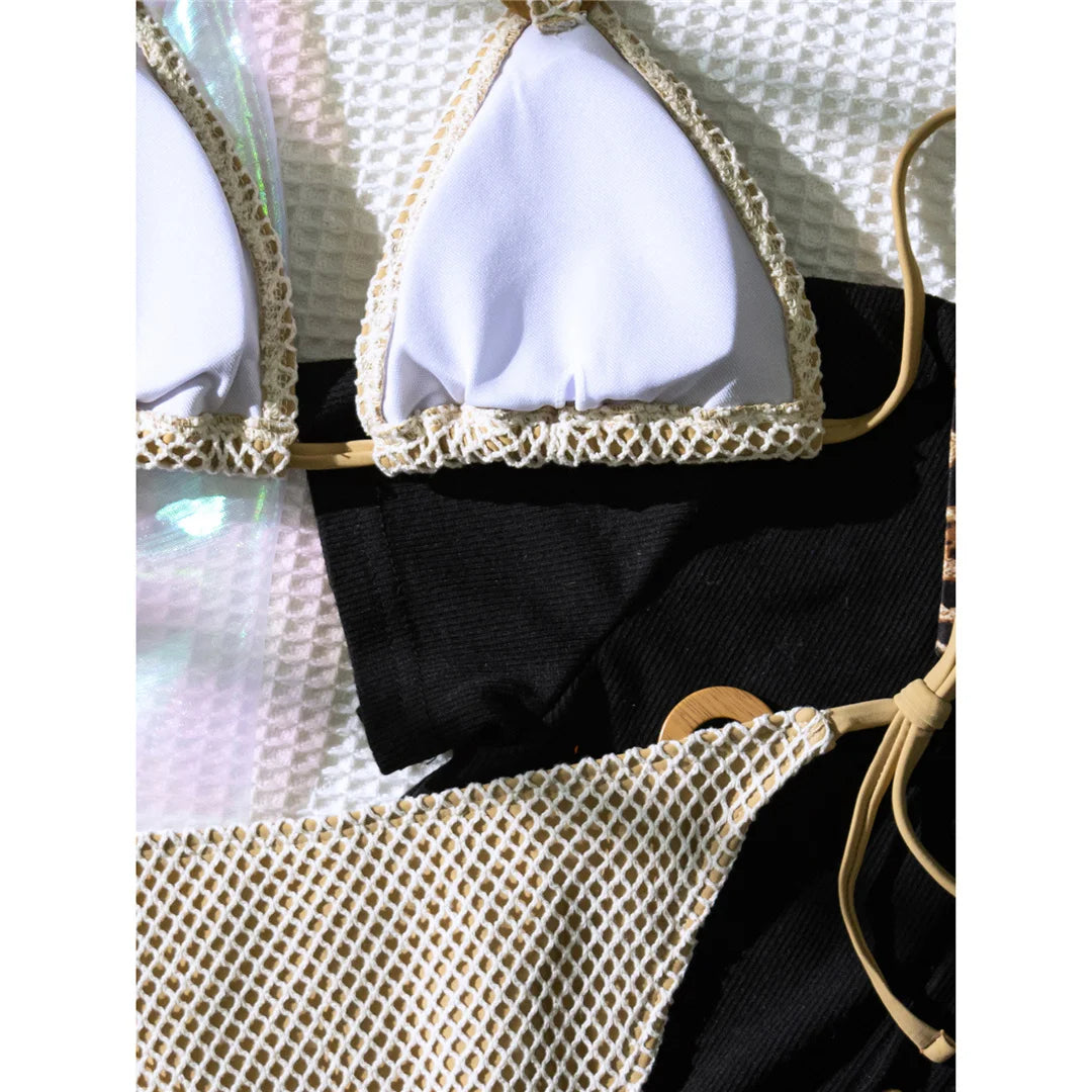 An elegant halter two-piece swimwear featuring sheer mesh and strappy detailing with a flattering high-cut leg, designed for a bold yet feminine beach look