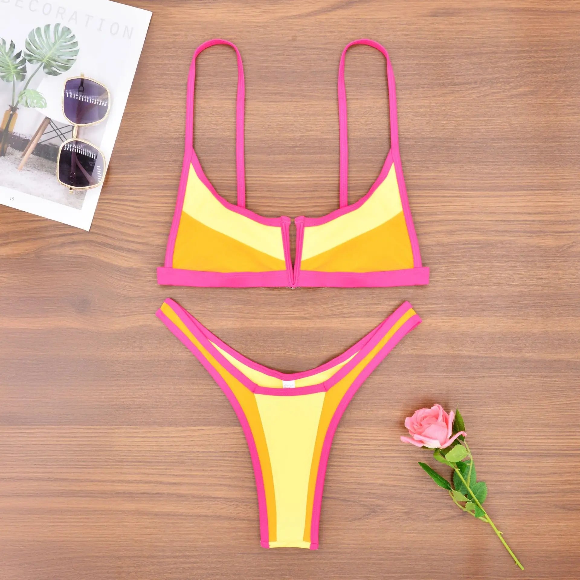 A sleek two-piece swimwear featuring a flattering V-shaped thong bottom and push-up top, designed for a bold yet elegant feminine beach look