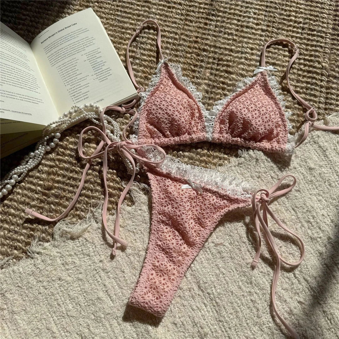 An elegant two-piece swimwear featuring delicate lace detailing, a halter neckline, and a mini thong high-cut leg design, crafted for a feminine and confident beach look