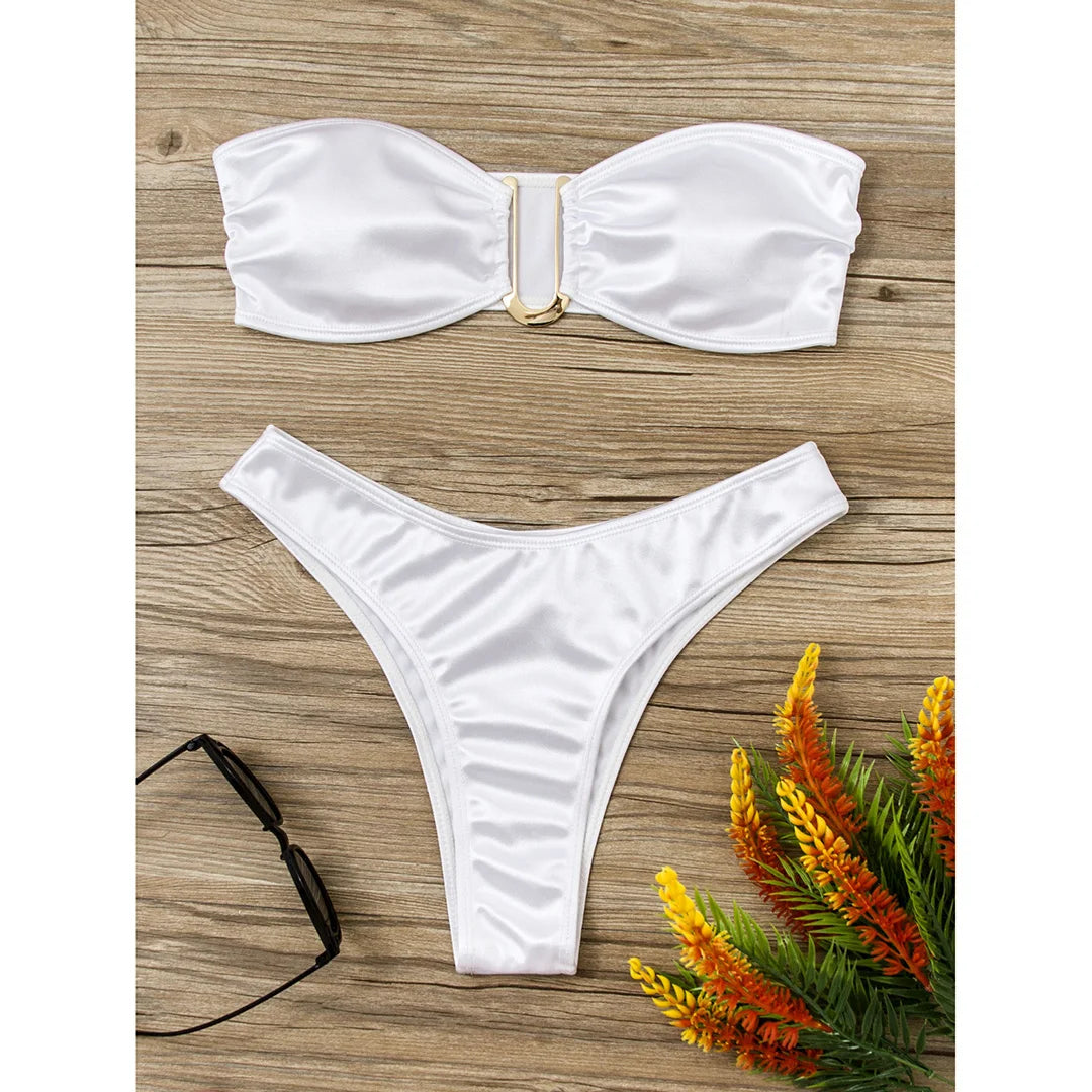 An elegant two-piece swimwear featuring a sleek strapless bandeau top with padded support, designed for a feminine, minimal, and confident beach look