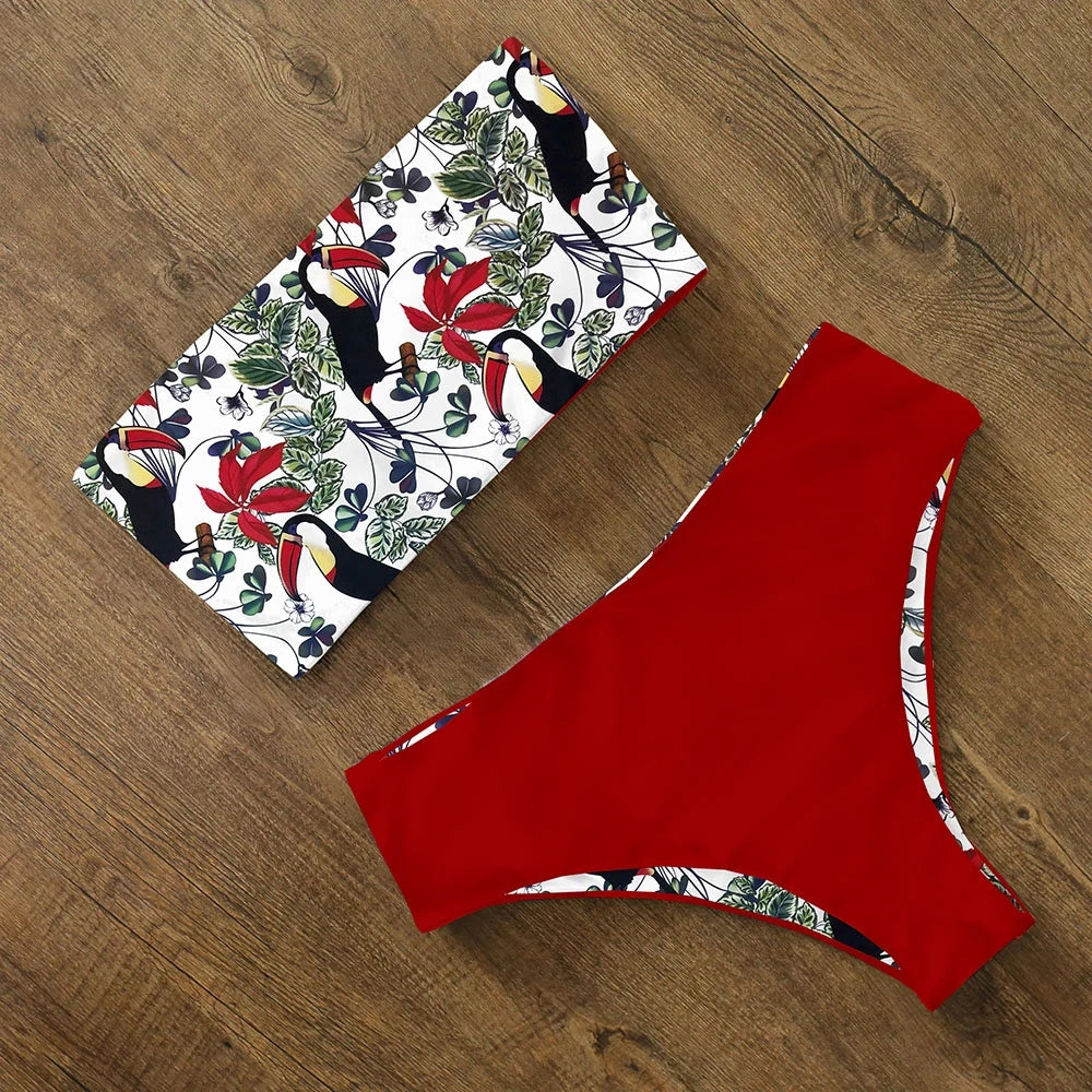 An elegant reversible two-piece swimwear featuring a bandeau top with cross-halter detail and a high-waisted bottom, designed for versatile, feminine summer style