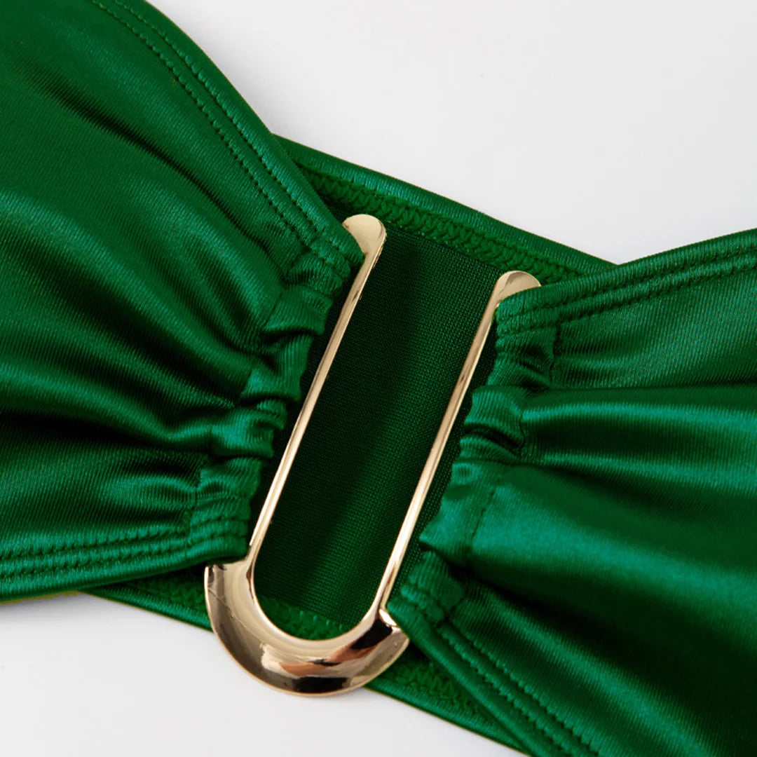 An elegant two-piece swimwear featuring a sleek strapless bandeau top with padded support, designed for a feminine, minimal, and confident beach look