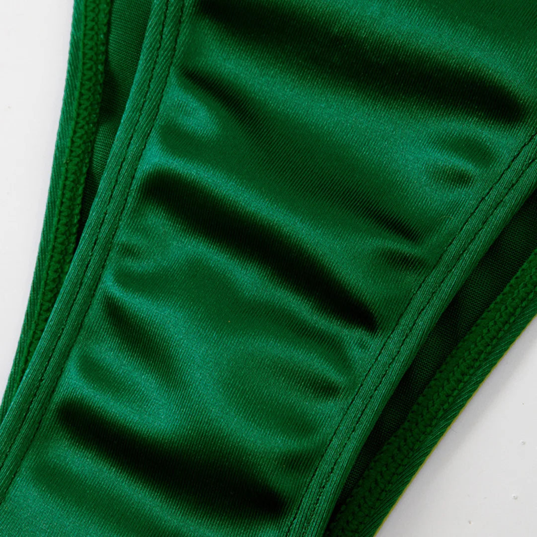 An elegant two-piece swimwear featuring a sleek strapless bandeau top with padded support, designed for a feminine, minimal, and confident beach look