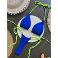 An elegant two-piece swimwear featuring refined splicing details, a halter neckline, and a mini thong high-cut silhouette, designed for a bold yet feminine beach statement