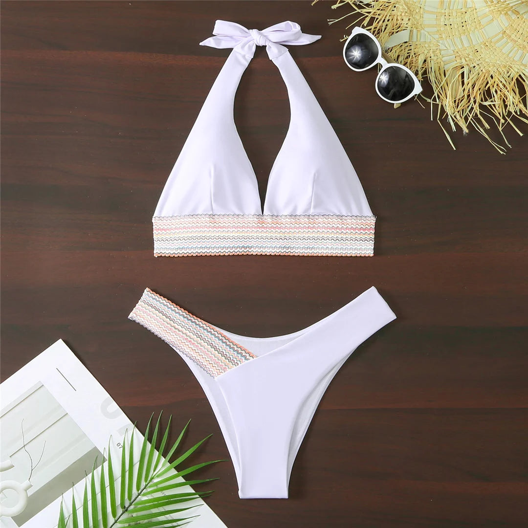 An elegant halter two-piece swimwear featuring refined color-splicing details and a flattering V-neck design, created for a modern, feminine beach style