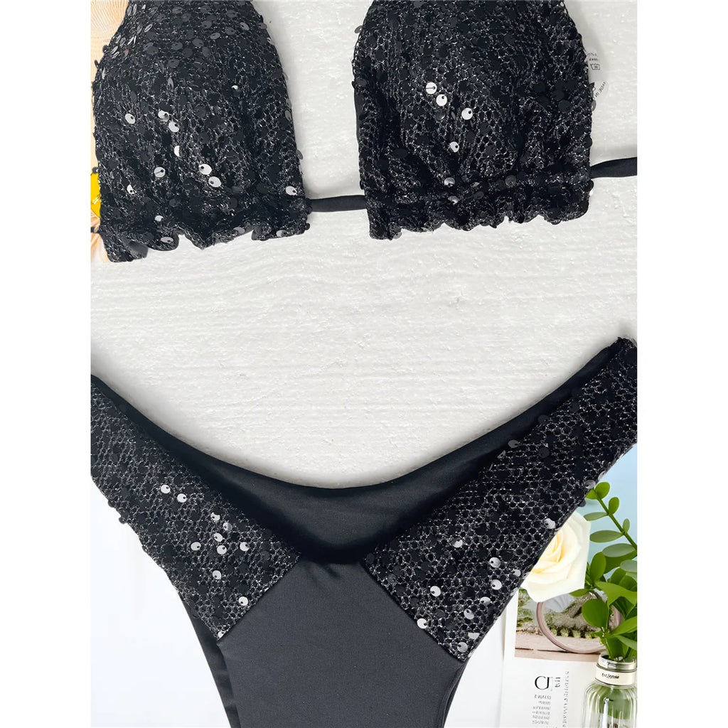 A sophisticated two-piece swimwear featuring a shimmering sequin halter top and high-cut bottoms, designed to enhance feminine elegance with a radiant, confident beach style