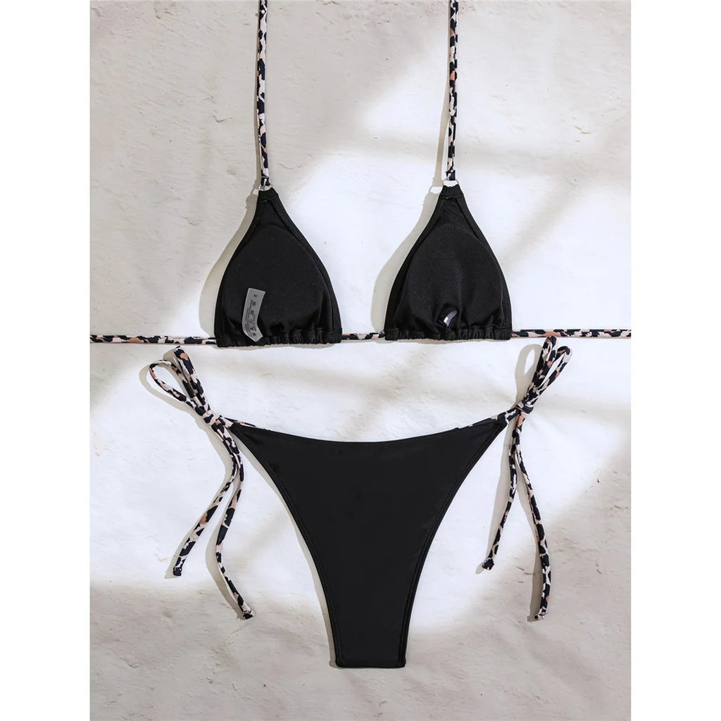 An elegant halter two-piece swimwear adorned with sparkling diamond star accents, designed for a feminine and radiant beach look with refined glamour