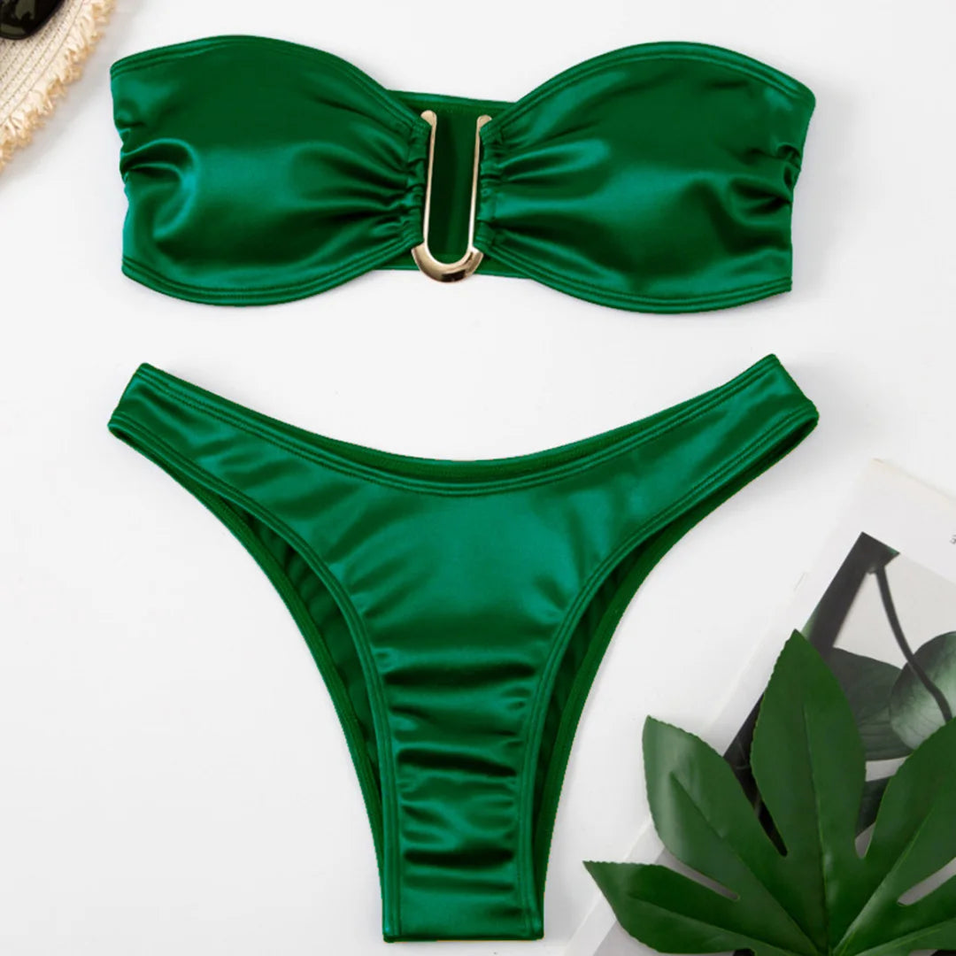 An elegant two-piece swimwear featuring a sleek strapless bandeau top with padded support, designed for a feminine, minimal, and confident beach look