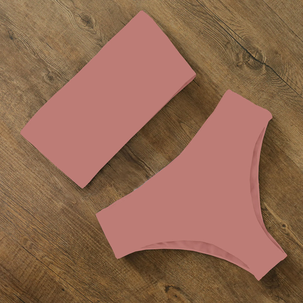 An elegant reversible two-piece swimwear featuring a bandeau top with cross-halter detail and a high-waisted bottom, designed for versatile, feminine summer style