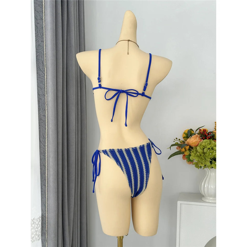 An elegant two-piece swimwear featuring a modern striped design, padded top, and flattering high-cut leg, created for a clean, feminine, and confident beach style