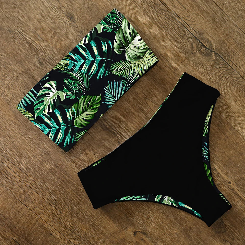 An elegant reversible two-piece swimwear featuring a bandeau top with cross-halter detail and a high-waisted bottom, designed for versatile, feminine summer style