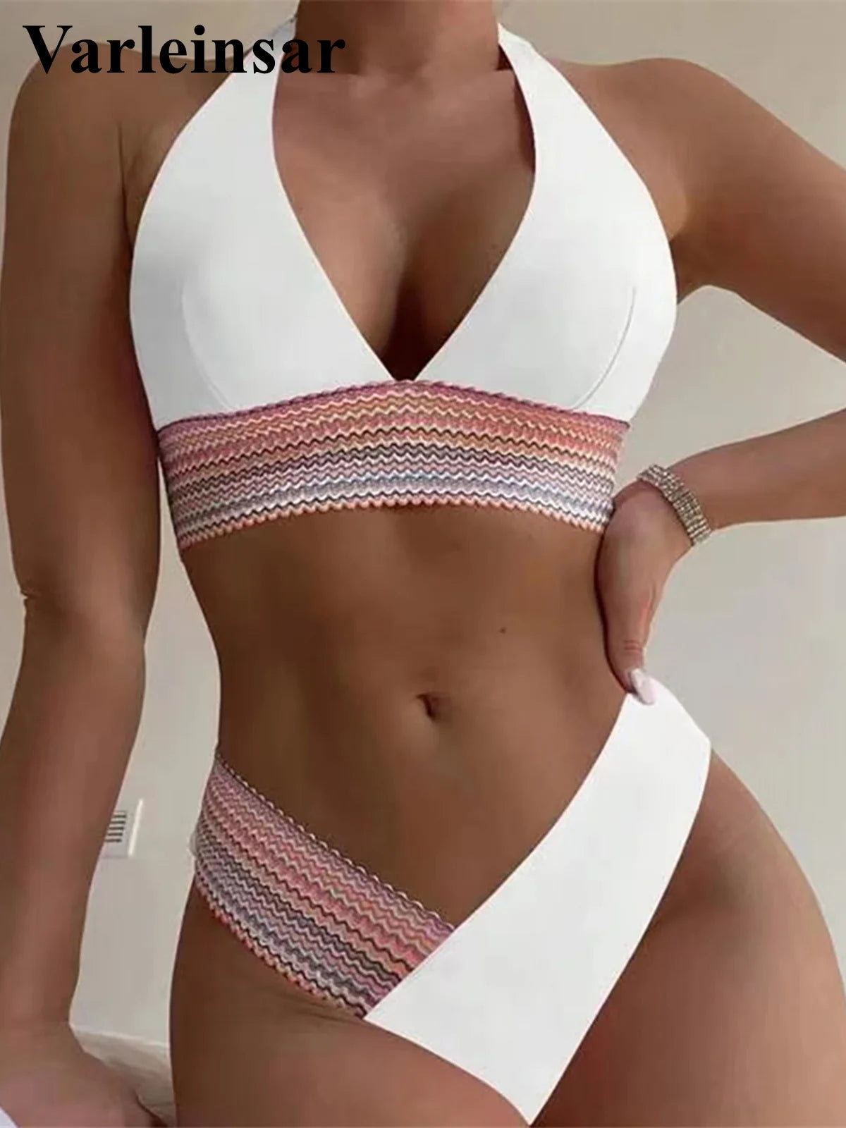 An elegant halter two-piece swimwear featuring refined color-splicing details and a flattering V-neck design, created for a modern, feminine beach style