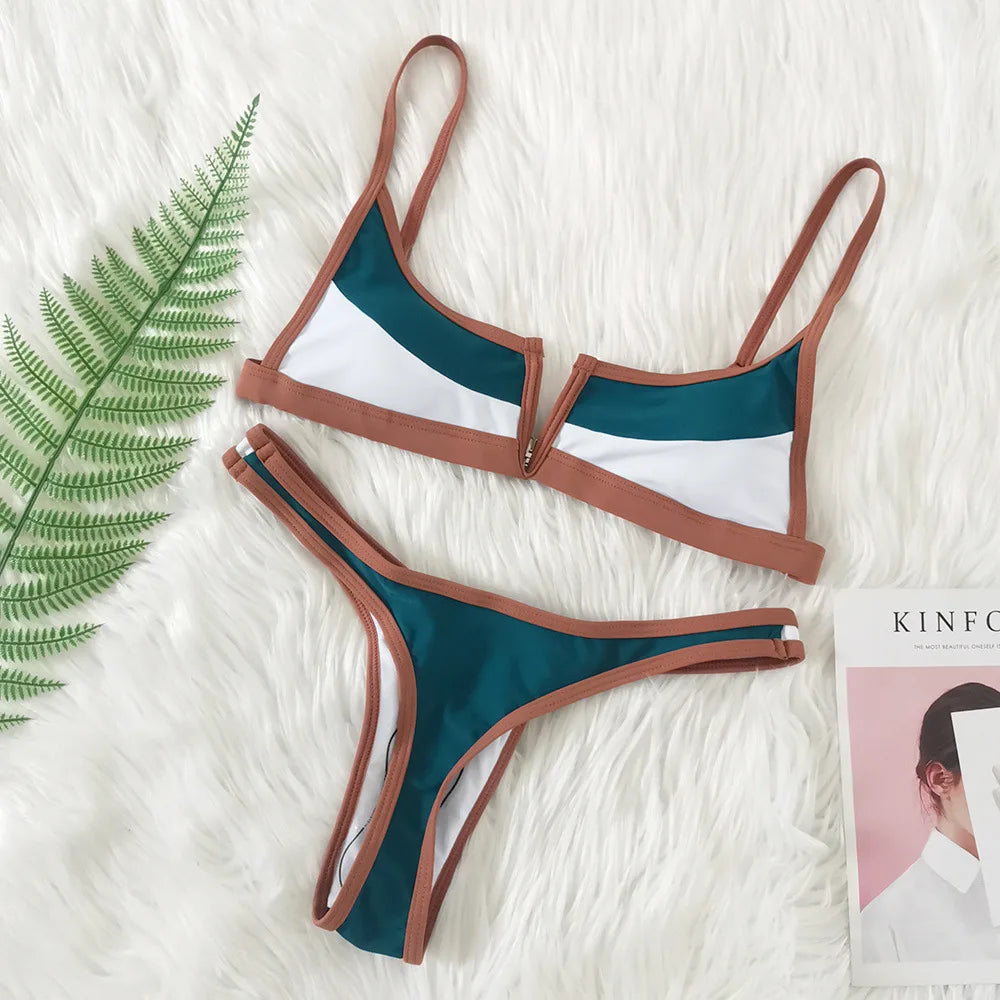 A sleek two-piece swimwear featuring a flattering V-shaped thong bottom and push-up top, designed for a bold yet elegant feminine beach look