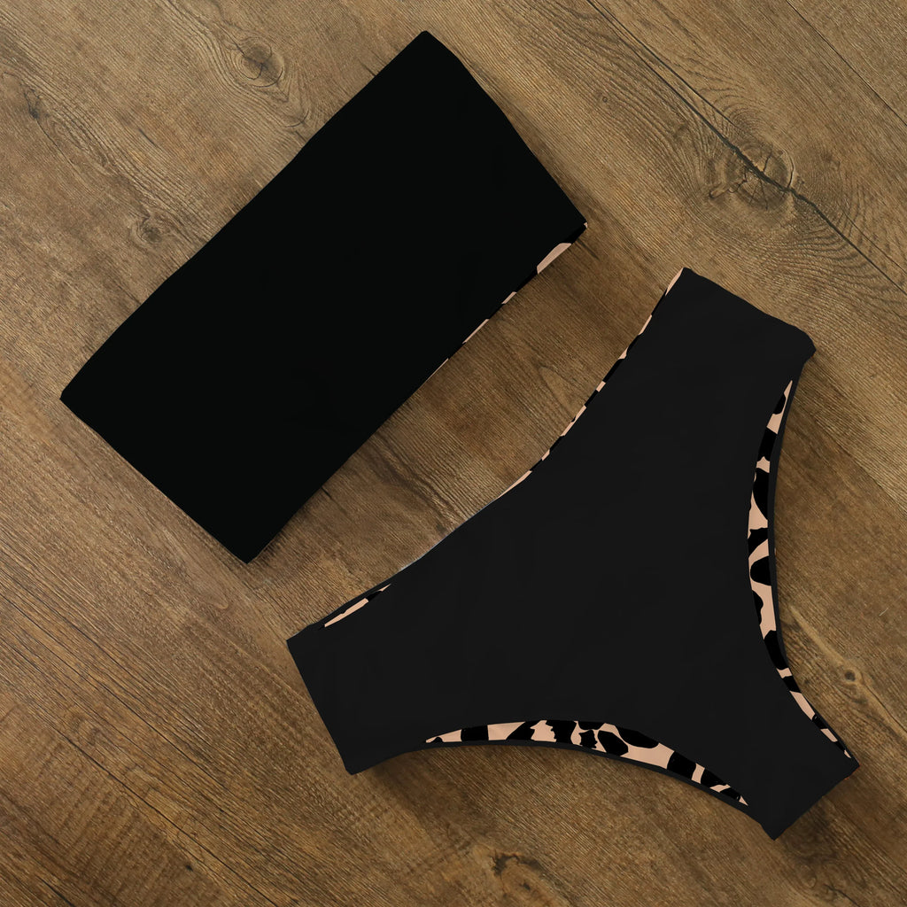 An elegant reversible two-piece swimwear featuring a bandeau top with cross-halter detail and a high-waisted bottom, designed for versatile, feminine summer style