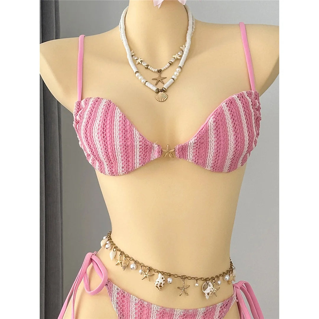 An elegant two-piece swimwear featuring a modern striped design, padded top, and flattering high-cut leg, created for a clean, feminine, and confident beach style