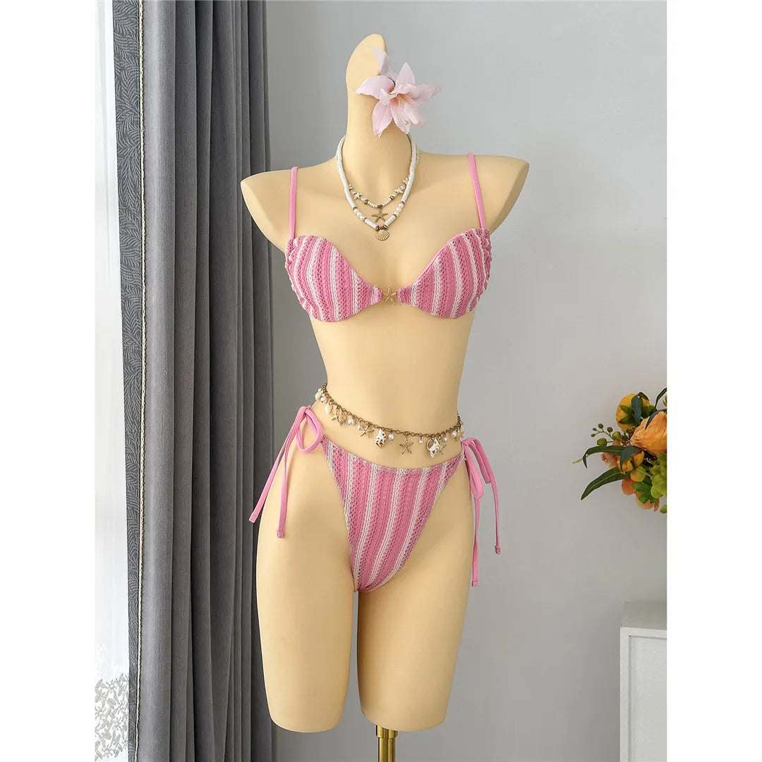 An elegant two-piece swimwear featuring a modern striped design, padded top, and flattering high-cut leg, created for a clean, feminine, and confident beach style