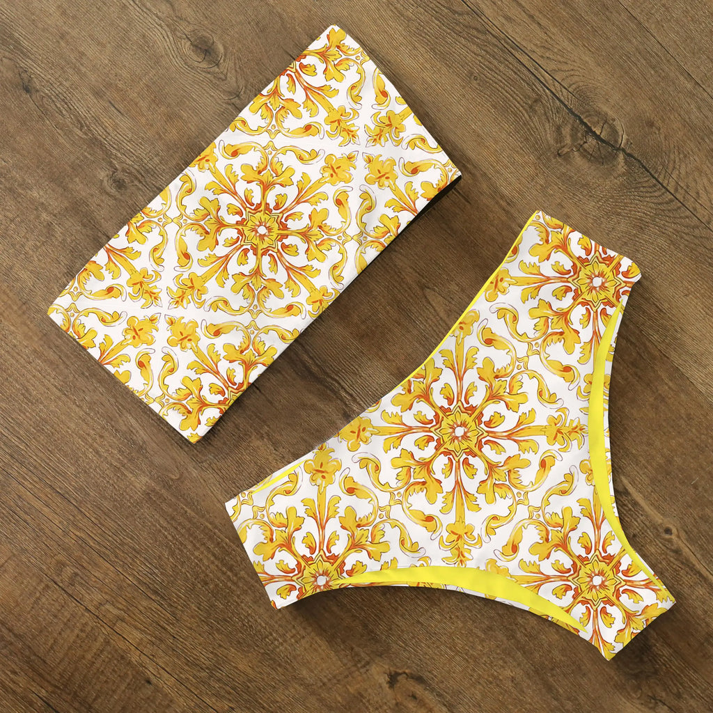 An elegant reversible two-piece swimwear featuring a bandeau top with cross-halter detail and a high-waisted bottom, designed for versatile, feminine summer style