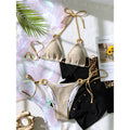 An elegant halter two-piece swimwear featuring sheer mesh and strappy detailing with a flattering high-cut leg, designed for a bold yet feminine beach look