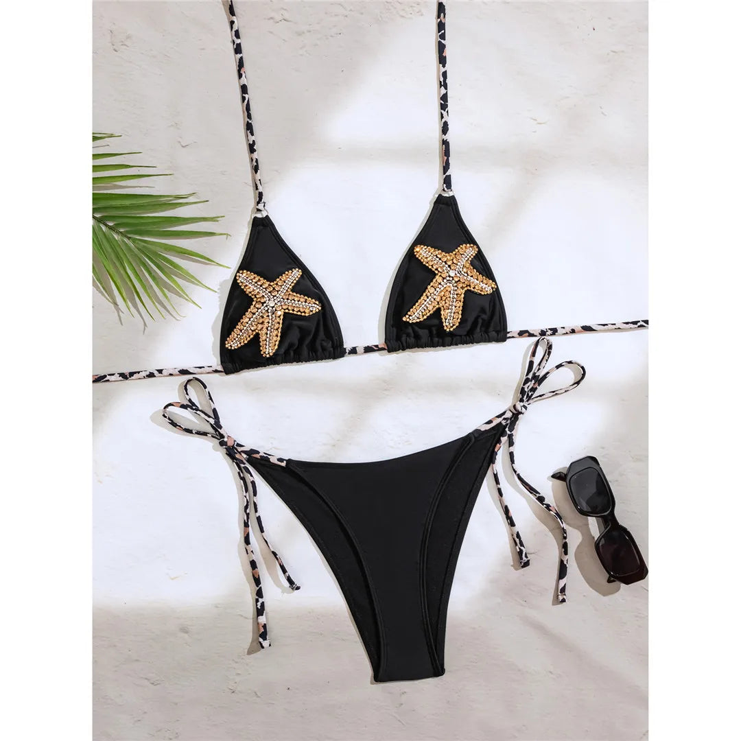 An elegant halter two-piece swimwear adorned with sparkling diamond star accents, designed for a feminine and radiant beach look with refined glamour