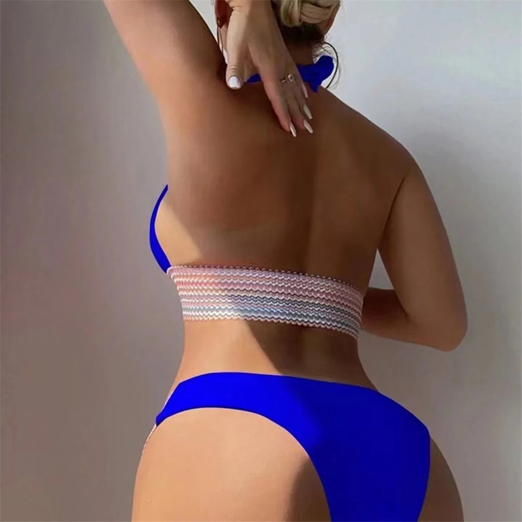 An elegant halter two-piece swimwear featuring refined color-splicing details and a flattering V-neck design, created for a modern, feminine beach style