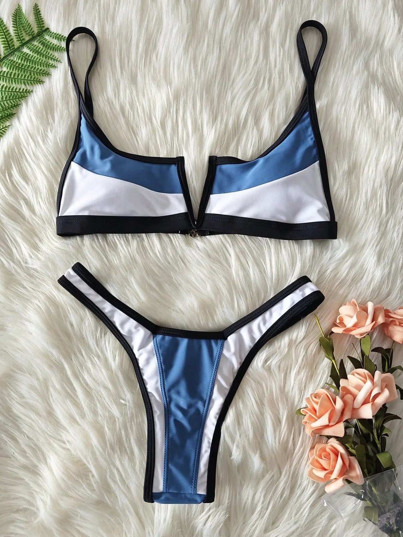 A sleek two-piece swimwear featuring a flattering V-shaped thong bottom and push-up top, designed for a bold yet elegant feminine beach look