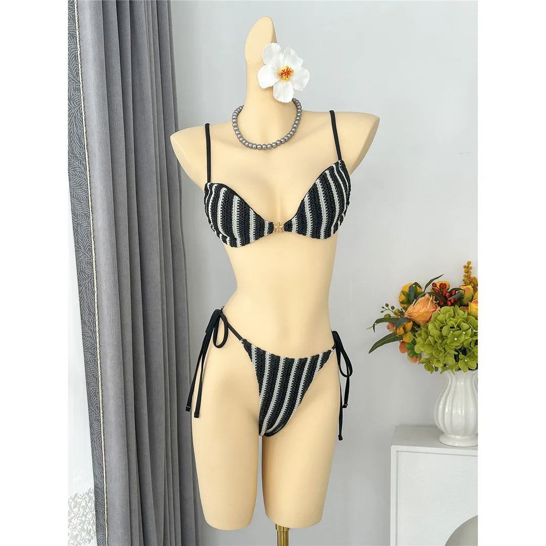 An elegant two-piece swimwear featuring a modern striped design, padded top, and flattering high-cut leg, created for a clean, feminine, and confident beach style