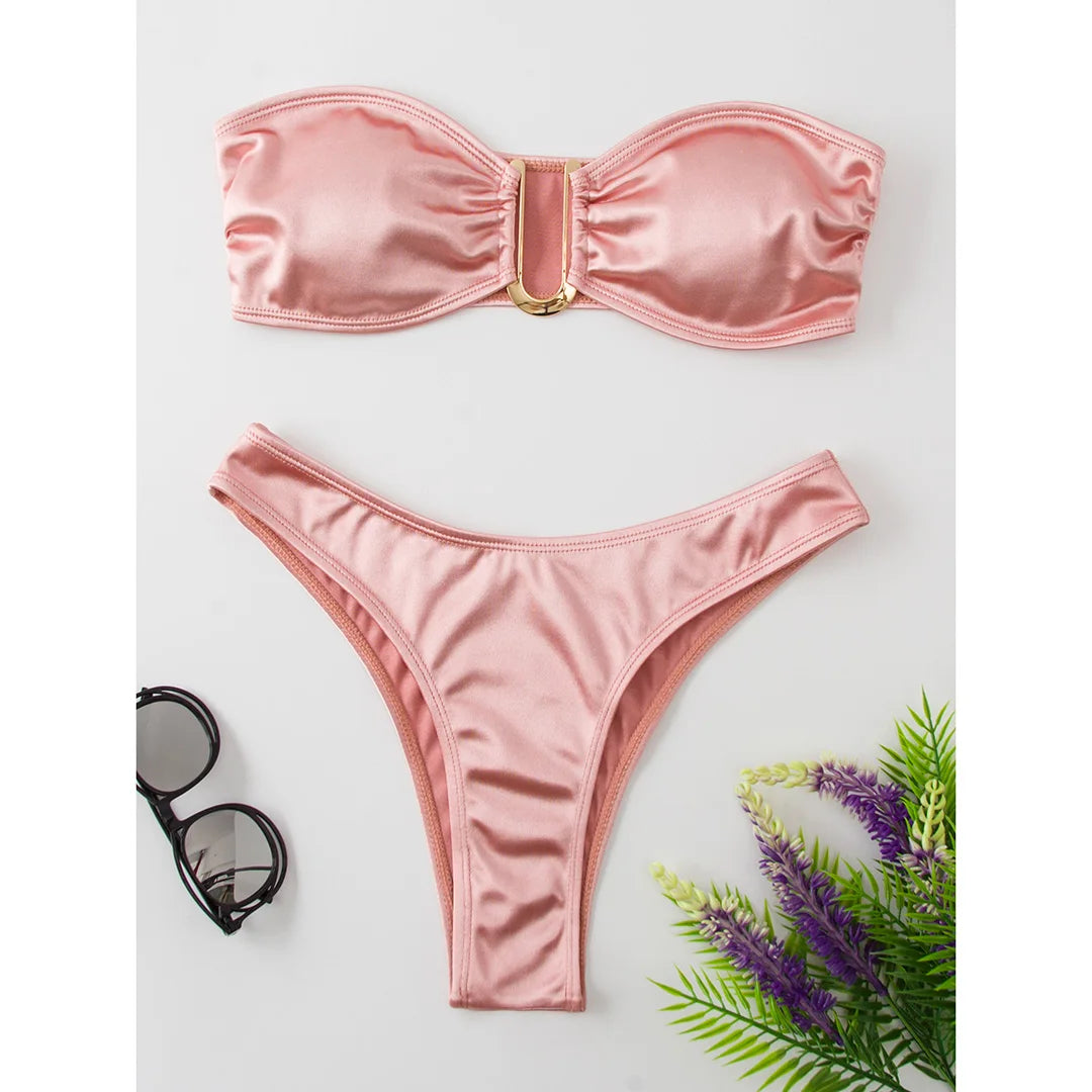 An elegant two-piece swimwear featuring a sleek strapless bandeau top with padded support, designed for a feminine, minimal, and confident beach look