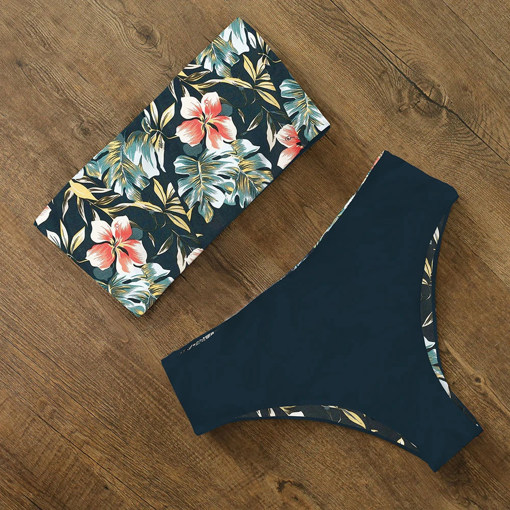 An elegant reversible two-piece swimwear featuring a bandeau top with cross-halter detail and a high-waisted bottom, designed for versatile, feminine summer style