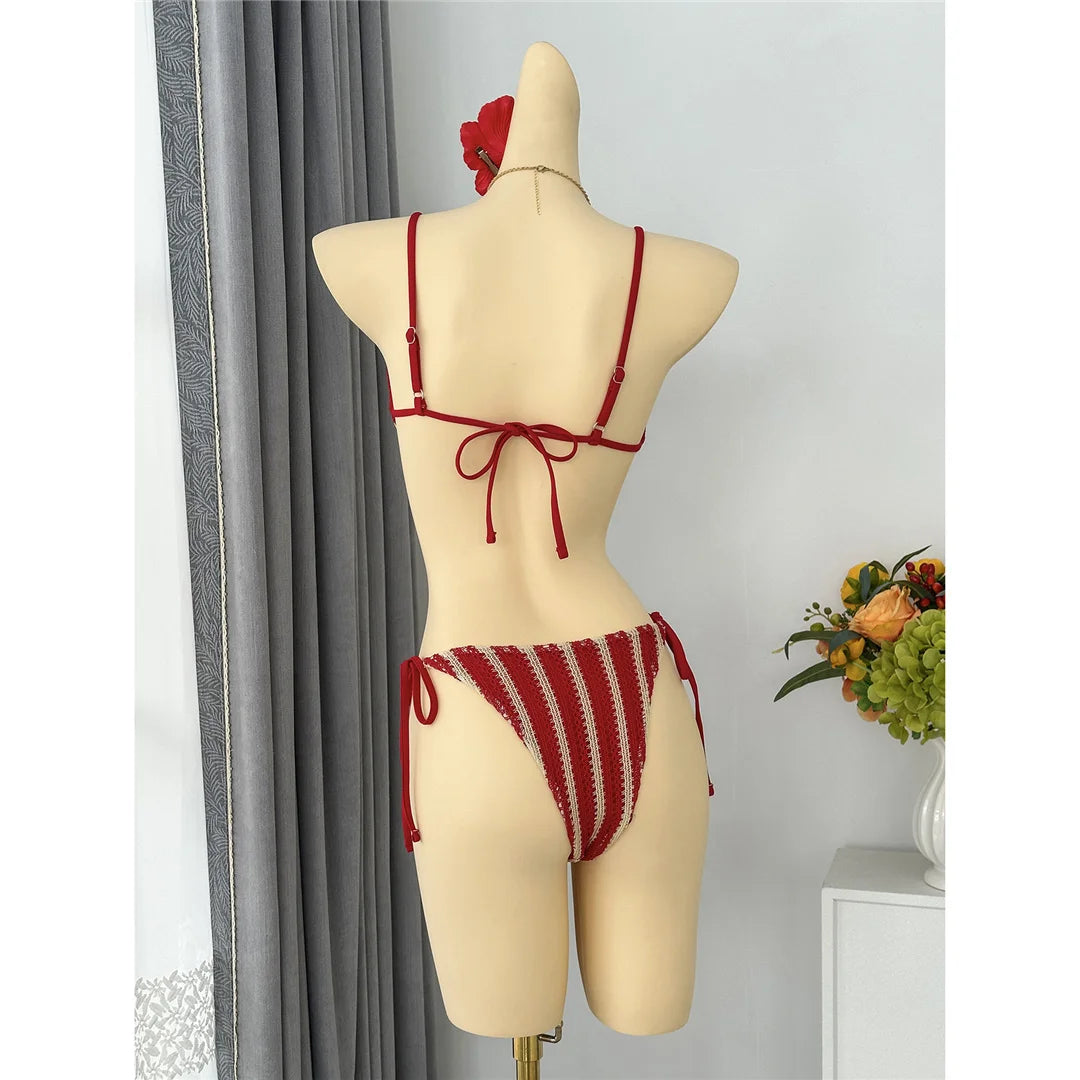 An elegant two-piece swimwear featuring a modern striped design, padded top, and flattering high-cut leg, created for a clean, feminine, and confident beach style