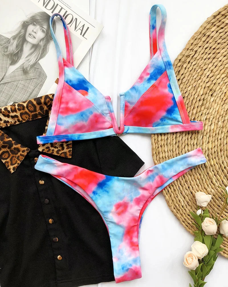 A sleek two-piece swimwear featuring a flattering V-shaped thong bottom and push-up top, designed for a bold yet elegant feminine beach look