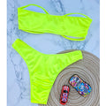 An elegant two-piece swimwear featuring a sleek strapless bandeau top with padded support, designed for a feminine, minimal, and confident beach look