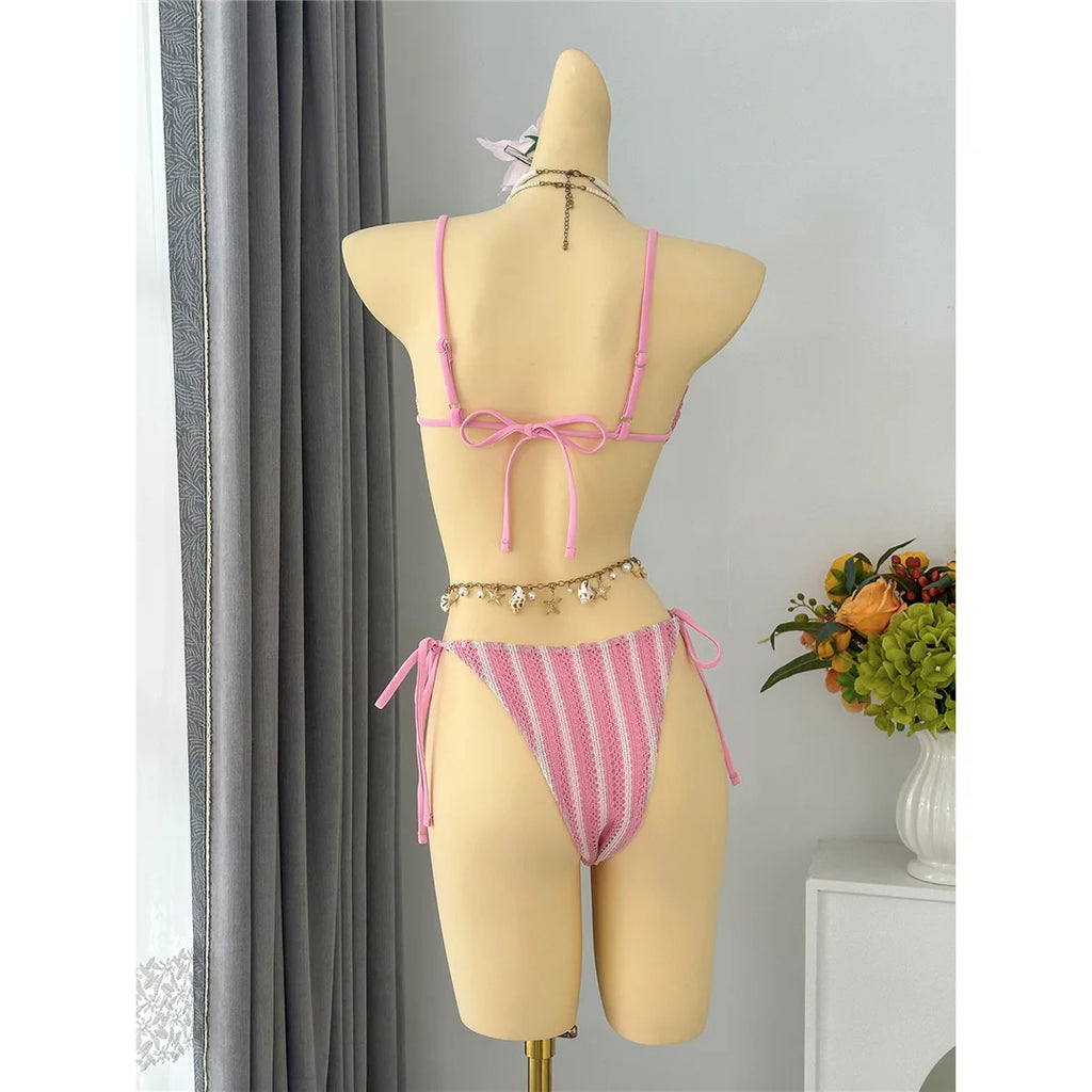 An elegant two-piece swimwear featuring a modern striped design, padded top, and flattering high-cut leg, created for a clean, feminine, and confident beach style