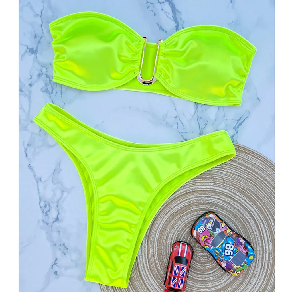 An elegant two-piece swimwear featuring a sleek strapless bandeau top with padded support, designed for a feminine, minimal, and confident beach look