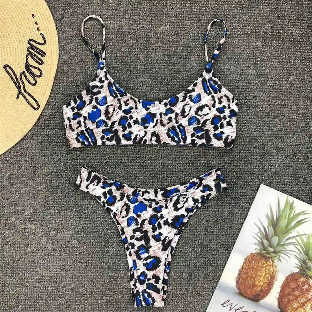 A refined leopard-print two-piece swimwear with a flattering Brazilian cut, designed to enhance feminine elegance and confident beach style
