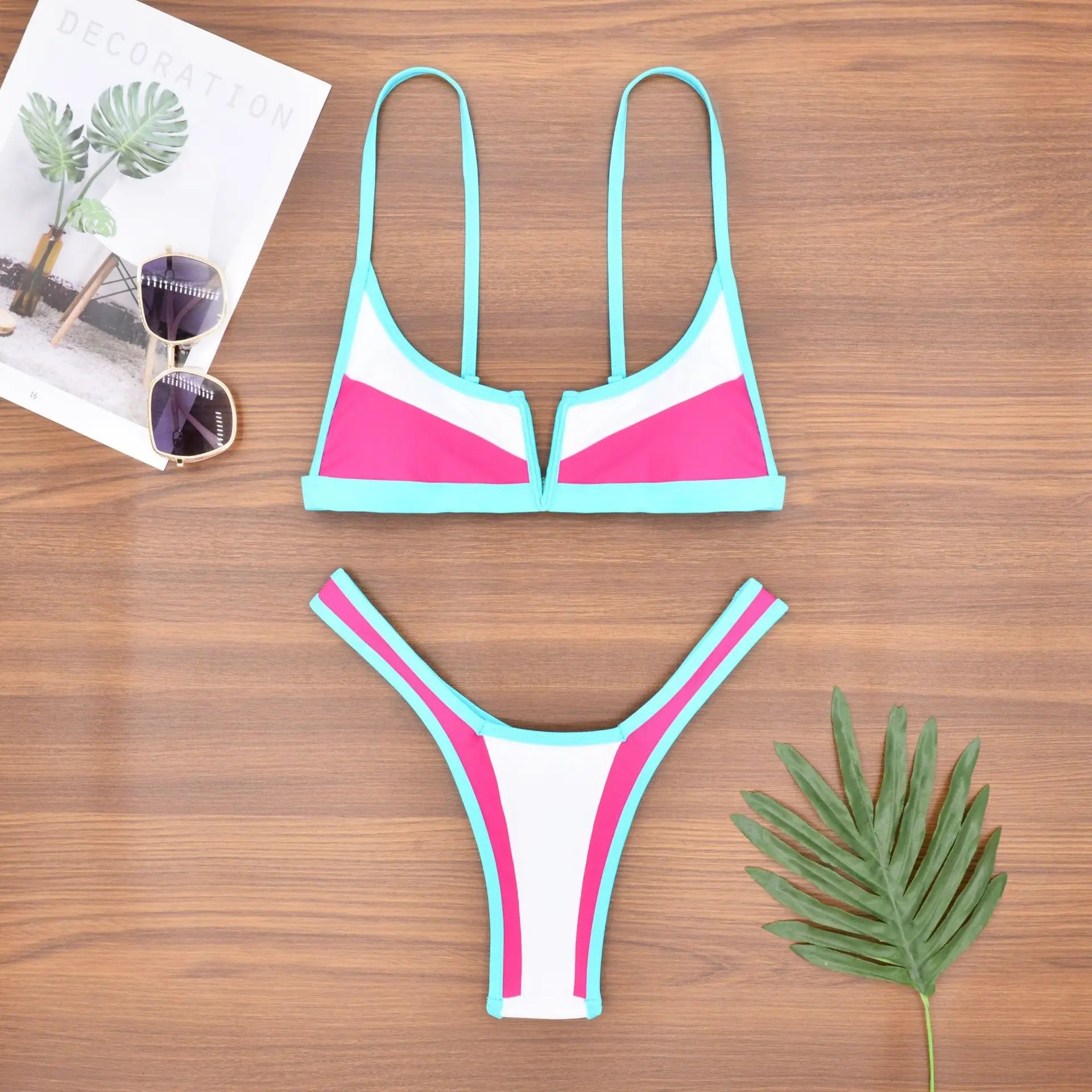 A sleek two-piece swimwear featuring a flattering V-shaped thong bottom and push-up top, designed for a bold yet elegant feminine beach look