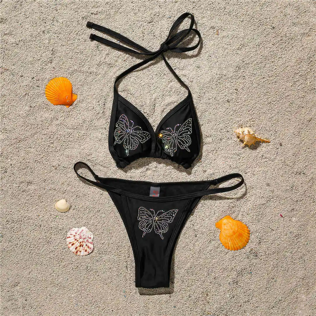 An elegant halter two-piece swimwear adorned with sparkling butterfly rhinestone details, designed to bring a feminine and radiant touch to your beach style