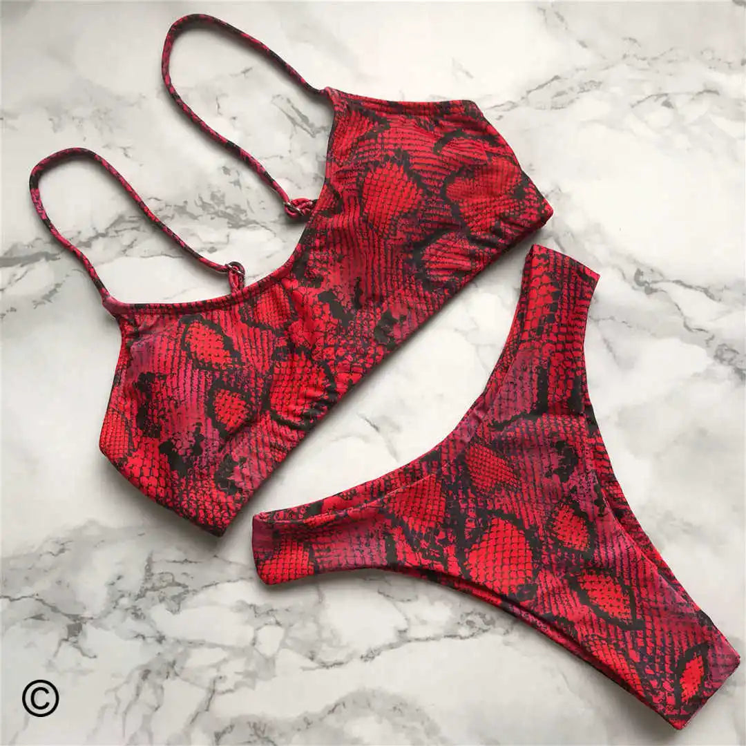 A refined leopard-print two-piece swimwear with a flattering Brazilian cut, designed to enhance feminine elegance and confident beach style