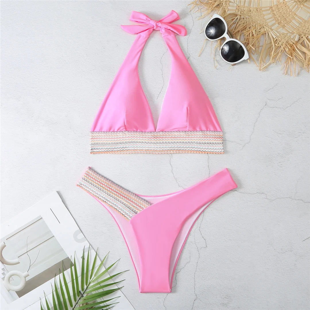 An elegant halter two-piece swimwear featuring refined color-splicing details and a flattering V-neck design, created for a modern, feminine beach style