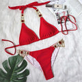 An elegant two-piece swimwear embellished with luxurious rhinestone detailing, designed to deliver a radiant and feminine beach look with a touch of refined glamour