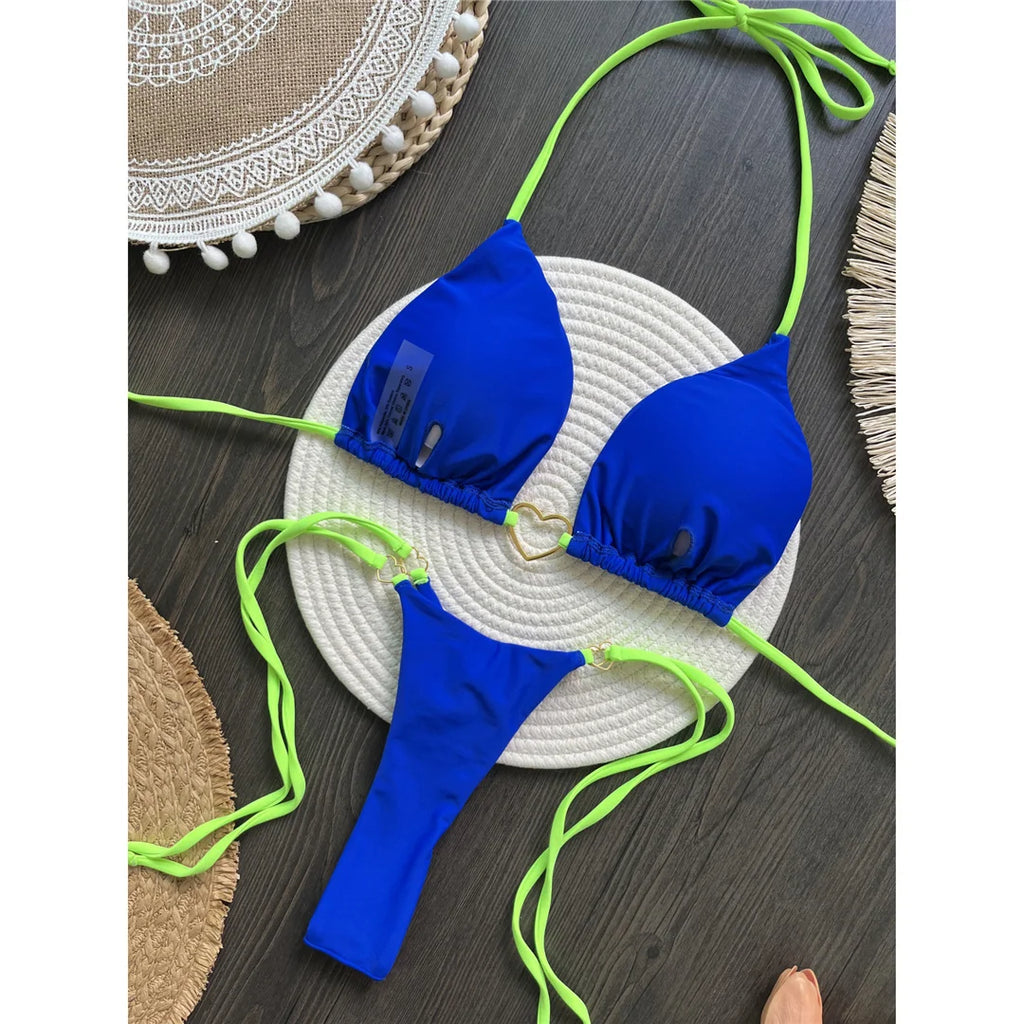 An elegant two-piece swimwear featuring refined splicing details, a halter neckline, and a mini thong high-cut silhouette, designed for a bold yet feminine beach statement