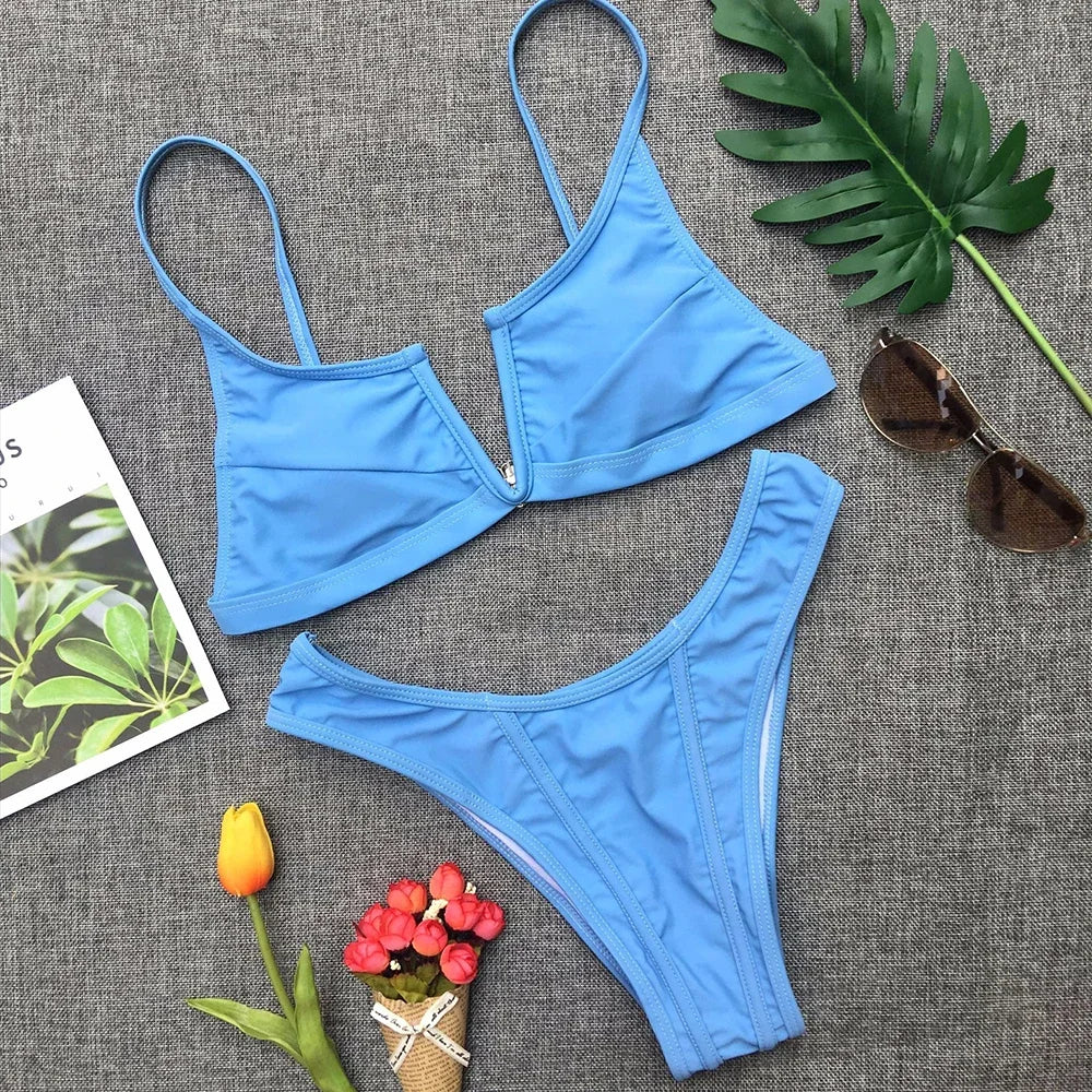 A sleek two-piece swimwear featuring a flattering V-shaped thong bottom and push-up top, designed for a bold yet elegant feminine beach look