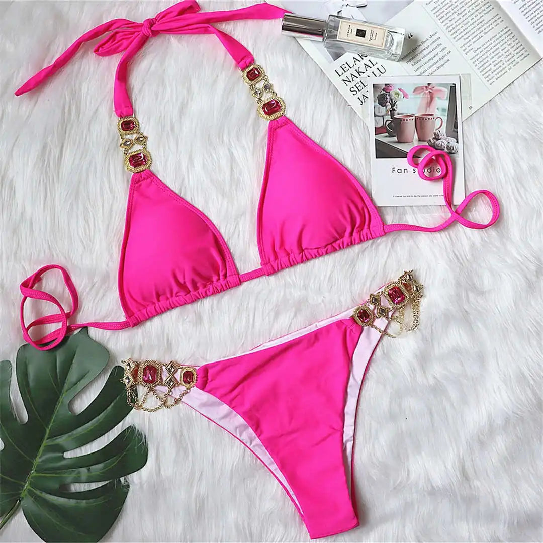 An elegant two-piece swimwear embellished with luxurious rhinestone detailing, designed to deliver a radiant and feminine beach look with a touch of refined glamour