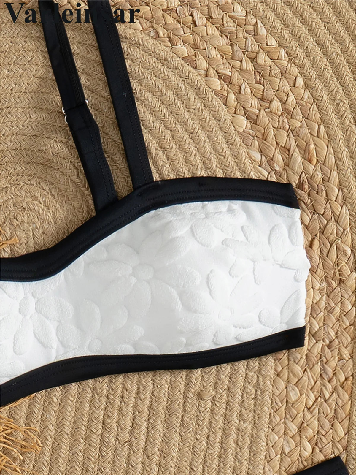 A refined two-piece swimwear featuring a padded top and flattering Brazilian high-cut leg, designed for an elegant and confident feminine beach look