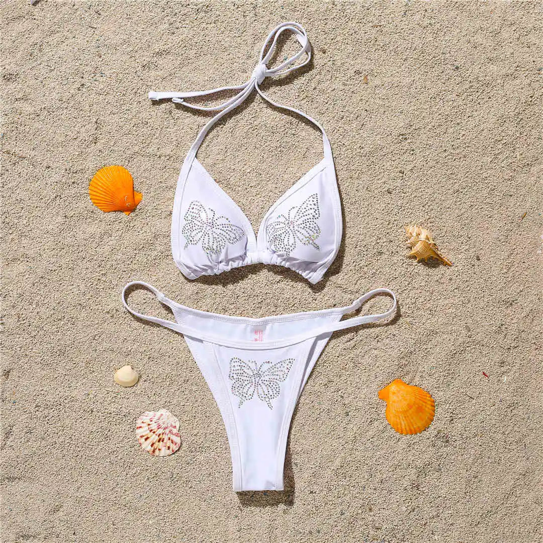 An elegant halter two-piece swimwear adorned with sparkling butterfly rhinestone details, designed to bring a feminine and radiant touch to your beach style