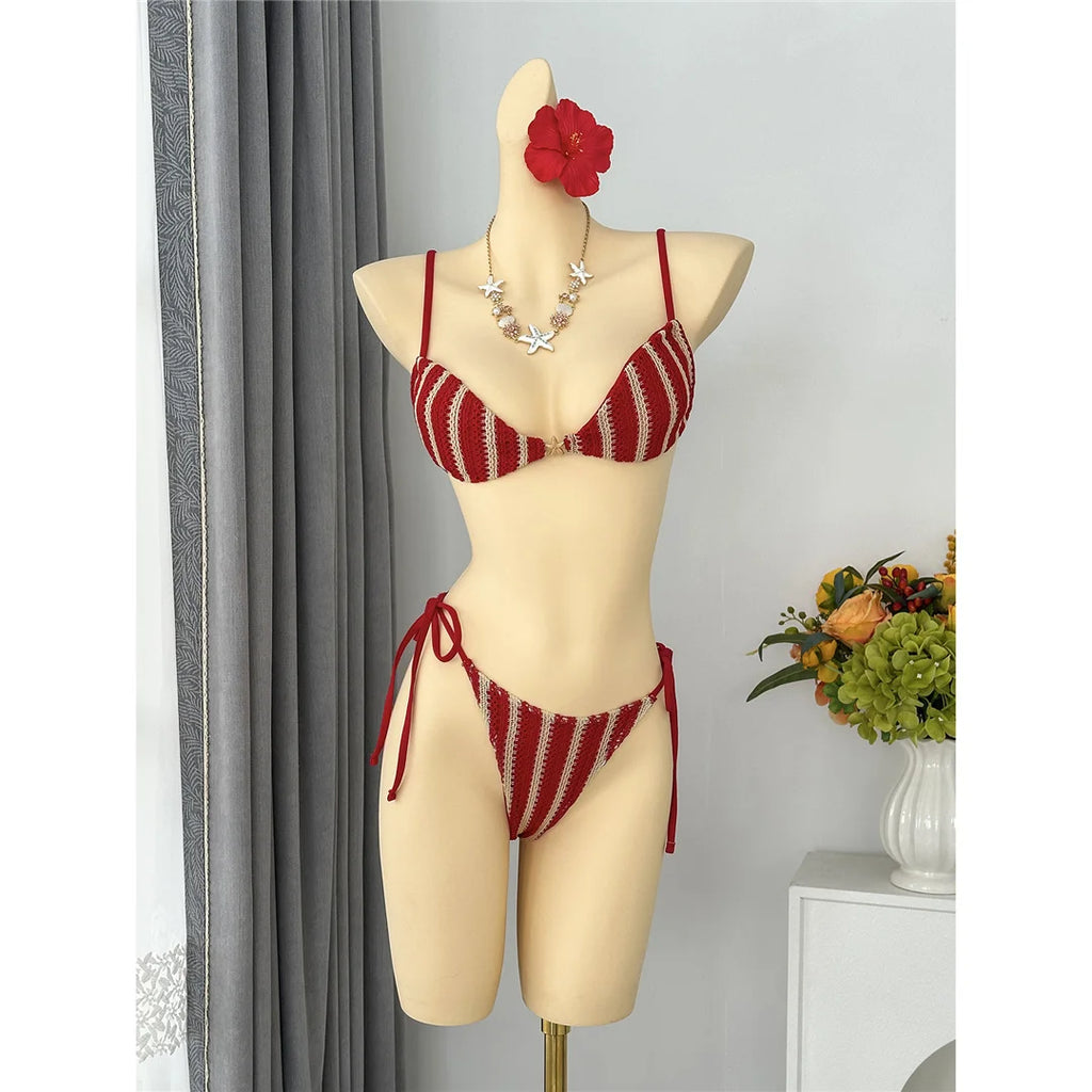 An elegant two-piece swimwear featuring a modern striped design, padded top, and flattering high-cut leg, created for a clean, feminine, and confident beach style
