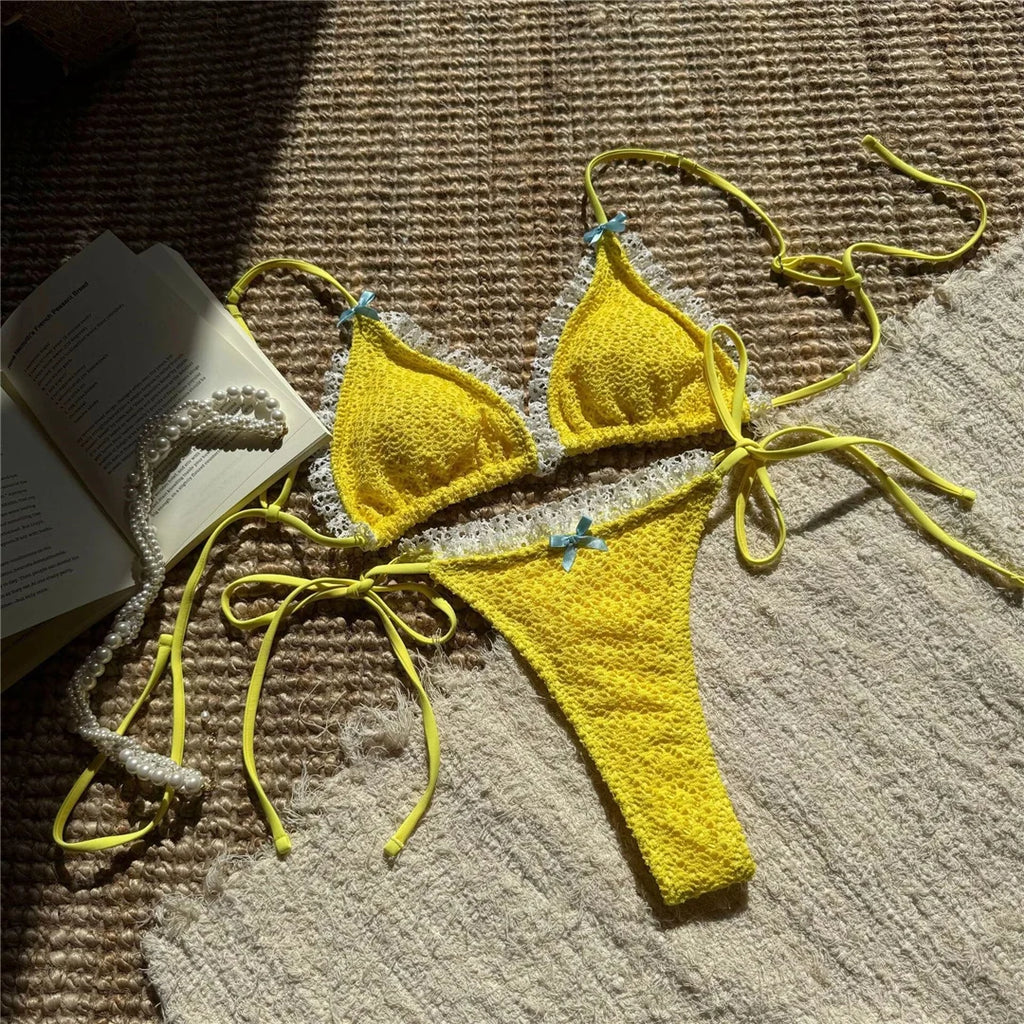 An elegant two-piece swimwear featuring delicate lace detailing, a halter neckline, and a mini thong high-cut leg design, crafted for a feminine and confident beach look
