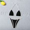 An elegant two-piece swimwear featuring refined pearl accents, a ribbed texture, and a flattering high-cut silhouette, designed for a timeless and feminine beach look