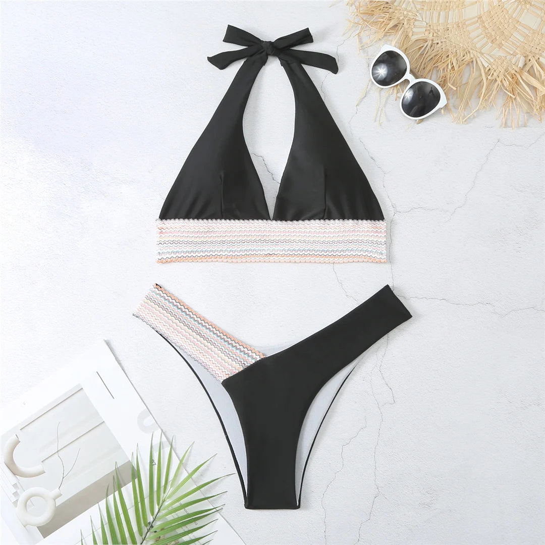 An elegant halter two-piece swimwear featuring refined color-splicing details and a flattering V-neck design, created for a modern, feminine beach style